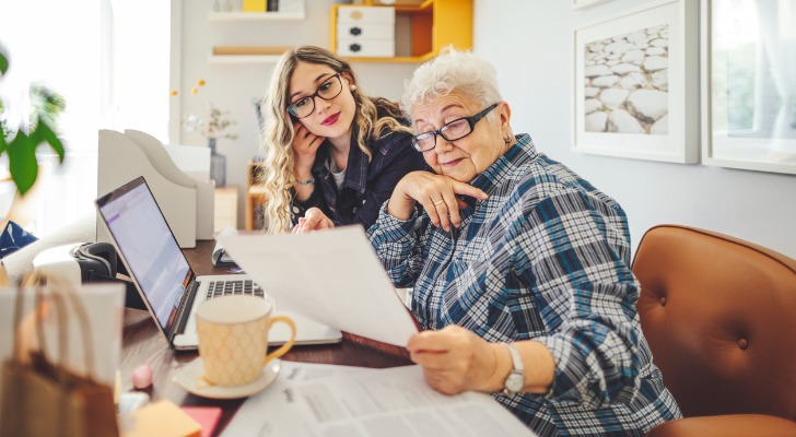A senior comparing fixed-income investments with an advisor.